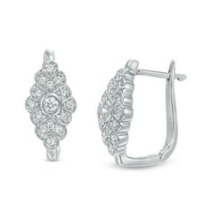 Petite and shimmering, these diamond hoop earrings are an everyday look of love. Crafted in cool 10K white gold, each curving kite-shaped design features a 1/20 ct. center diamond wrapped in looped frames of smaller diamonds. Radiant with 1/5 ct. t.w. of diamonds and a bright polished shine, these sparkling hoops secure with hinged backs. Look Of Love, Diamond Hoop Earrings, Diamond Clarity, Diamond Stone, Earring Backs, White Metal, Stone Settings, Designer Earrings, Fashion Earrings