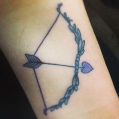 a bow and arrow tattoo on the arm with an arrow, heart and two arrows