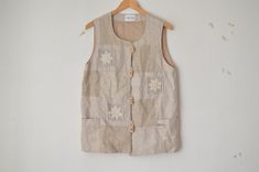 tagged size: 38 measurements taken flat: bust: 49 cm / 19.2 in  length: 67 cm / 26.3 in  shoulder to shoulder: 37 cm / 14.5 in  material: 100% linen, flutter: 100% viscose Beige Cotton Vest With Button Closure, Vintage Patchwork Vest For Summer, Bohemian Sleeveless Vest With Buttons, Vintage Summer Vest With Button Closure, Sleeveless Beige Vest With Buttons, Beige Sleeveless Vest With Buttons, Summer Beige Vest With Buttons, Sleeveless Vest, Vest Outfits