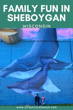 two people standing in front of a mural with the words family fun in sheboygan wisconsin