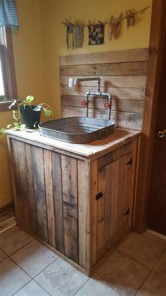 a sink made out of wooden planks in a bathroom with tile flooring and yellow walls