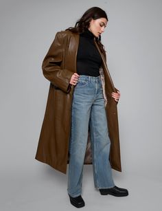 Brown leather trench coat with dropped oversized lapel and front pockets .100% faux leather100% polyester liningFit is oversizedFront pockets Padded shoulders Single button closureModel is wearing one size and model's height is 5.8"/172 cmImported