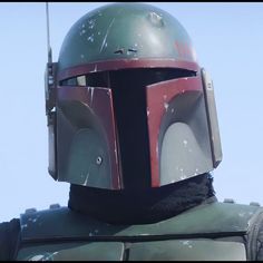 the boba fett helmet is on display in front of a blue sky background