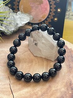 "One Genuine Black Tourmaline Bead Bracelet Due to the nature of the gemstones, each gemstone is subject to slight variations. Extra Small - 6.5\" Fits wrists measuring 5.5\" to 6\" Small - 7\" Fits Fits wrists measuring 6\" to 6.5\" Medium - 7.5\" Fits wrists measuring 6.5-7\" Large - 8\" Fits wrists measuring 7\" to 7.5\" Extra Large - 8.5\" Fits wrists measuring 7.5\" to 8\"" Obsidian Beaded Bracelets For Healing, Onyx Gemstone Beads Stretch Bracelet, Obsidian Gemstone Beads Crystal Bracelet, Healing Black Beaded Bracelets, Obsidian Beaded Bracelets With Natural Stones, Black Healing Beaded Bracelets With Round Beads, Obsidian Hand-strung Round Beaded Bracelets, Onyx Gemstone Beaded Bracelets, Black Obsidian Beaded Bracelets