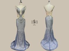 two mannequins dressed in blue and silver gowns, one with an open back