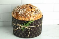 a loaf of bread sitting on top of a counter next to a white tile wall