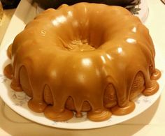 a bundt cake with caramel icing on a plate