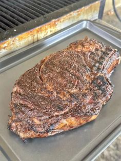 a piece of steak sitting on top of a grill