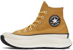 High-top cotton twill sneakers in yellow. Faux-leather logo patch at inner side. · Round textured rubber cap toe · Lace-up closure · Canvas lining · Padded CX foam footbed · Foam rubber platform midsole · Treaded rubber outsole · Platform: H1.5 in Supplier color: Burnt honey/Thriftshop yellow Canvas High-top Sneakers With Vulcanized Sole For Outdoor, Retro Brown Sneakers For Outdoor, Outdoor High-top Sneakers With Rubber Toe Cap, Sporty Canvas High-top Sneakers For Outdoor, Retro Brown Outdoor Sneakers, Mustard Converse Sneakers For Streetwear, Casual Canvas Sneakers With Logo, Casual Lace-up High-top Sneakers With Logo Patch, Converse Mustard Sneakers With Round Toe