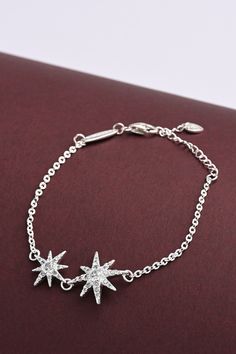 This sterling silver bracelet is inspired by the bright countless stars in the sky. This dazzling Bejeweled Star Sterling Silver Bracelet will illuminate your day and add a touch of sophistication to your daily wear. Sterling Silver Star Bracelet As Gift, Adjustable Silver Chain Bracelet With Star Charm, Adjustable Sterling Silver Star Bracelet, Adjustable Silver Star-shaped Chain Bracelet, Nickel-free Silver Star Bracelet, Evil Eye Bracelet Silver, Mens Sterling Silver Bracelets, Silver Infinity Bracelets, Sterling Silver Heart Bracelet