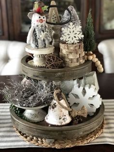 two tiered trays with snowmen and other decorations