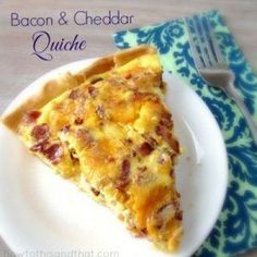 a slice of bacon cheddar quiche on a white plate