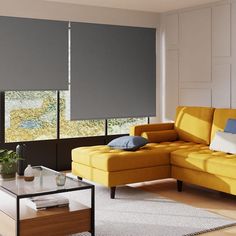 a living room with yellow couches and grey shades on the window sills