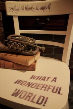 a white chair with some books on top of it