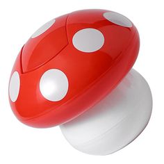 a red and white mushroom shaped object with polka dots