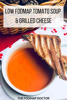 grilled cheese and tomato soup in a bowl with text overlay reading low fodmap tomato soup & grilled cheese