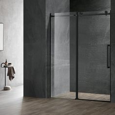 a bathroom with a glass shower door next to a sink and towel rack on the wall