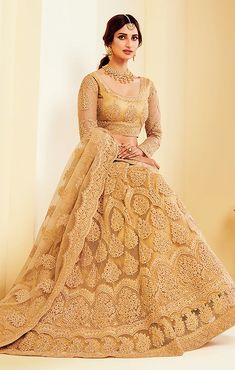 This Lehenga Choli is Ready to Wear A stunning lehenga with beautiful Cording & Thread blouse, dupatta and lehenga, designed specially for wedding season Blouse & Lehenga Fabric - Net Inner Fabric - Santoon Dupatta Fabric - Net Color - Golden Style -Partywear, Engagement, Sangeet Lehenga Embroidery - Cording & Thread Choli Length - 16 Inches Lehenga Length - 44 Inches NOTE : Originally stitched in size 42 but can be altered for size 40 & 44 without any extra cost. Black Pakistani Dress, Net Lehenga Choli, Ghaghra Choli, Indian Dresses Online, Net Lehenga, Lehenga Choli Online, Bridal Lehenga Choli, Designer Lehenga Choli, Embroidered Wedding