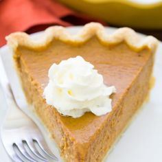 a slice of pumpkin pie with whipped cream on top