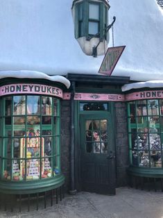 the front of a store that is covered in snow