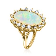 Ross-Simons - C. 1980 Vintage Opal, .75ct t. w. Diamond Ring Oval Cut in 14kt Yellow Gold. Size 5. C. 1980. Swirling with a nearly magical play of color, this sensational Estate collection cocktail ring celebrates the unique beauty of its 18x10mm oval opal cabochon centerpiece. Finely crafted in polished 14kt yellow gold and bordered by .75 ct. t. w. round brilliant-cut diamonds. 7/8" wide. Diamond and opal ring. Exclusive, one-of-a-kind Estate Jewelry. Opal birthstones are the perfect gift for Diamond Ring Oval, Opal And Diamond Ring, Opal Birthstone, Jewelry Opal, Ring Oval, Unique Beauty, Opal Ring, Round Brilliant Cut Diamond, Cocktail Ring