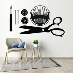 a wall decal with scissors, pins and needles