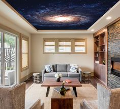 a living room filled with furniture and a sky mural on the ceiling above it's windows