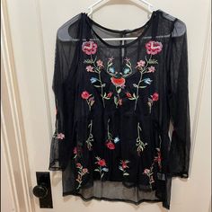 Flowy Fine Mesh With Flower Embroidery Black Embroidered Summer Blouse, Black Long Sleeve Embroidered Top, Black Embroidered Long Sleeve Top For Summer, Black Long Sleeve Embroidered Top For Summer, Fall Black Top With Floral Embroidery, Black Tops With Embroidered Hem For Fall, Black Long Sleeve Tops With Floral Embroidery, Black Long Sleeve Embroidered Top With Floral Print, Black Floral Embroidered Long Sleeve Tops