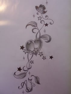 a drawing of two hearts with stars and swirls on the side of a wall