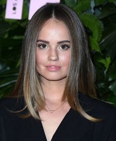 a close up of a person with long hair