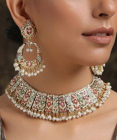 Borrowing from the age old technique of Pakistani aari and Punjabi jadau work, this necklace set is based in silver alloy and plated with 22k gold. The combination of these pristine colours paints a lovely picture embellished with shell pearls and semi precious stones. Necklace Closure - Adjustable Dori Earrings Closure - Push Back Style Tip - Versatility and elegance being the strong suit, we leave a lot to your imagination for how you want to dress your jewels your way and embracing your perso Luxury Meenakari Necklaces For Festive Season, Jadau Sets Indian Jewelry, Jadau Set, Jadau Gold Necklace Set, Jadau Jewellery, Jadau Choker Set, Luxury Gold Necklaces For Navratri, Jadau Three Piece Necklace Bridal, Rajput Jewellery