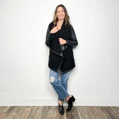 This Spanx jacket is the perfect combination of style and comfort. Made from our signature Faux Leather and featuring cozy fleece detailing, it is the ideal third layer for when temperatures start to drop. Not only will it keep you warm, but it will also elevate any look with its effortless style. Front pockets Long sleeves Flexible fabric that allows you to move in comfortable without sacrificing the look of leather No need to dry clean Care instructions:Machine wash cold on gentle cycle, insid Long Sleeve Leather Jacket For Layering, Cozy Fleece Jacket For Fall Layering, Fall Outerwear With Faux Fur Trim For Cold Weather, Winter Leather Jacket For Layering, Winter Leather Jacket For Casual Wear, Faux Fur Lined Outerwear For Fall Workwear, Fall Outerwear With Faux Fur Lining, Winter Leather Outerwear With Long Sleeves, Leather Long Sleeve Winter Outerwear