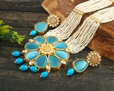 "This is a stunning handmade necklace perfect for high end Jewelry Collector, a keeper in Traditional Vintage Indian/Pakistani Bridal jewelry and a Luxury Gift for your Daughter, Sister or Wife on Wedding or Anniversary. Perfect for any type of occasions, weddings And celebrations and a beautiful & memorable gift for weddings and special occasions. -Item Code:- L7003 -Aqua Blue Monalisa Rajwada Necklace Set with Earrings. -Designer white  beaded necklace with Kundan pendant. -Gold Plated Set wit Turquoise Pendant Jewelry For Wedding, Beaded Kundan Pendant Necklace For Wedding, Turquoise Round Beads Necklace For Wedding, Turquoise Beaded Necklaces For Wedding With Round Beads, Turquoise Necklaces With Round Beads For Wedding, Turquoise Beaded Necklaces With Round Beads For Weddings, Turquoise Beaded Necklaces For Wedding, Turquoise Beaded Necklace For Weddings, Elegant Turquoise Beaded Necklaces For Weddings