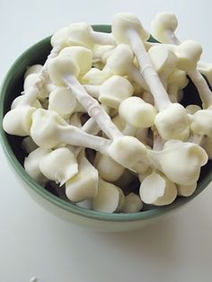 a bowl filled with white mushrooms sitting on top of a blue table next to an instagram page