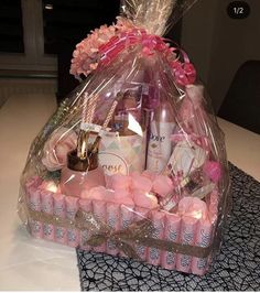 a bag filled with lots of pink items on top of a table