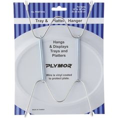 a white plate with two metal hangers attached to the front and back of it