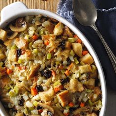 a casserole dish filled with stuffing and vegetables