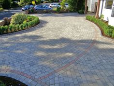 a brick driveway in front of a house