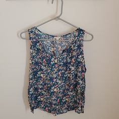 Size: L Petite Color: Blue Pattern Material: 100% Rayon Casual Sleeveless Top With Ditsy Floral Print, Casual Sleeveless Ditsy Floral Print Top, Casual Sleeveless Ditsy Floral Top, Blue Cotton Tops With Ditsy Floral Print, Sleeveless Ditsy Floral Print Tops For Beach, Summer Blue Tops With Ditsy Floral Print, Summer Blue Top With Ditsy Floral Print, Casual Blue Top With Ditsy Floral Print, Casual Blue Tops With Ditsy Floral Print