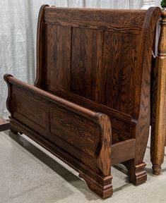 a wooden bed frame sitting on top of a floor