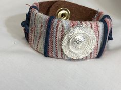 Beautifully unique handmade leather bracelet. Made with an authentic concho, 100% leather bracelet with snap closure - adorned with fabric, ribbon, rawhide etc!  No two are alike & each one made is one of its own kind. ~ 8 inches in length, snap sits just a 1/2 in. on center of each end making them a wearable 7 in. length Artisan Adjustable Cuff Bracelet With Concho, Adjustable Concho Cuff Bracelet For Festival, Bohemian Adjustable Bracelets With Concho, Adjustable Concho Cuff Bracelet Gift, Adjustable Bohemian Concho Bracelets, Bohemian Adjustable Concho Bracelets, Artisan Adjustable Concho Cuff Bracelet, Vintage Leather Concho Bracelet For Festival, Vintage Concho Leather Bracelet For Festival