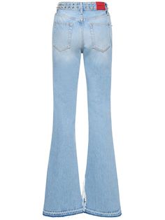 Front button and concealed zip closure. Belt loops. Metal studded details. Raw cut released hem with slit. Five pockets. Model is wearing a size27 Denim Flare Jeans, Studded Denim, Alessandra Rich, Rich Women, Denim Flares, Flared Jeans, Shearling Jacket, Swimwear Tops, Flare Jeans