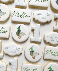 decorated cookies with ducks and other words on them are arranged in the shape of numbers