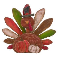 a wooden turkey decoration with pumpkins and leaves