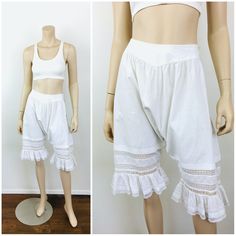 Antique / Vintage Early 1900s Cotton Bloomers - button closures at back waist - lace at leg w/ pin tuck pleat detail - fine white cotton material great vintage condition   appx size - S  26 waist full hip 25.5 length All sales are final / as-is. We do not accept returns. No returns on items that do not fit or color variation. Vintage Lace Trim Bottoms For Summer, Vintage Bottoms With Lace Trim For Summer, Fitted Cotton Bottoms With Lace Trim, Casual Cotton Bottoms With Broderie Anglaise, Vintage White Lace Bottoms, White Vintage Lace Bottoms, White Lace Vintage Bottoms, Vintage Style Stretch Bottoms With Lace Trim, Vintage Stretch Bottoms With Lace Trim