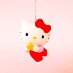 A hello kitty shaped ornament holding a star and wearing a red outfit with her signature red bow. Christmas Icons For Apps Hello Kitty, Hello Kitty Tree Christmas Ornament, Hello Kitty Christmas Ornament, Christmas Avatar, Snowflake Tutorial, Xmas Clipart, Star Png, Hello Kitty Bow, Kitty Christmas