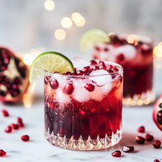 pomegranate and limes are garnished with ice