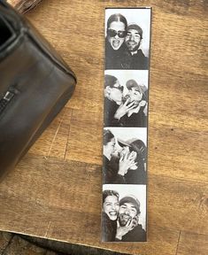 a wooden table topped with pictures of people