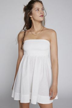 Rent Aurora Smocked Mini Dress from Nuuly. Pick 6 items for $98/month. Free shipping + returns. Urban Outfitters White Dress, Smocked Mini Dress, White Strapless Dress, Allover Pattern, Bow Detail Dress, Tube Dress, White Mini Dress, Dress With Bow, Tie Backs