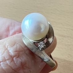 Stunning Vintage Ring In Solid 14k White Gold ( Stamped & Tested). When I Purchased It At The Rstate Sale, I Loved Everything About This Ring: The Heafty Chunky Setting, The Sparkling Diamonds On The Side, But The Pearl Was Dull So, My Jeweler Sent Me To The Pearl Wholeseller In The Nyc Jewelry District And Together We Chose This Beautiful, Round, White, Large 10mm Pearl For This Setting. When My Jeweler Set This New Pearl Into This Beautiful Vintage Setting, Its As If She Was Always There : A Perfect Match !!! Each Side Diamond Is Approx 2.3 Mm In Size , Genuine, Tested, I Do Not Have Color/ Clarity Info. Naked Eye Very Sparkly!!! So, This Is Truly A One Of A Kind Ring !!! Classic White Gold Jewelry For Anniversary, Exquisite 14k White Gold Jewelry, Round Diamond Pearl Ring, Elegant Solitaire Jewelry In 14k White Gold, Formal Brilliant Cut Pearl Ring In Platinum, Platinum Solitaire Jewelry For Anniversary, Elegant 14k White Gold Solitaire Jewelry, White Pearl Ring With 17 Jewels For Formal Occasions, Classic 14k White Gold Jewelry For Anniversary